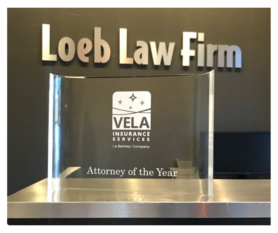 Scott Loeb receives attorney of the year award by Vela Insurance Services